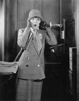 Moore Collection: TELEPHONE BOOTH, 1920s. Colleen Moore in a 1920s silent movie still