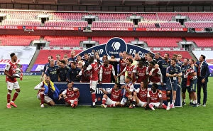 Stadium Art Collection: Arsenal's Aubameyang Lifts FA Cup After Empty-Stadium Victory Over Chelsea