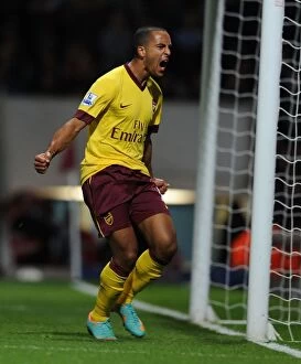 Newham Collection: Theo Walcott's Brace: Arsenal's Victory over West Ham United (2012-13)