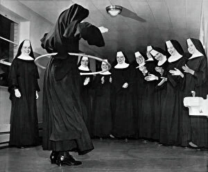 Oklahoma City Photographic Print Collection: Nun Swivels Hula Hoop On Hips