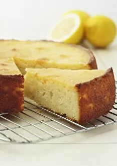 Food and Drink Photographic Print Collection: Slice of sticky lemon cake on cooling rack, close-up