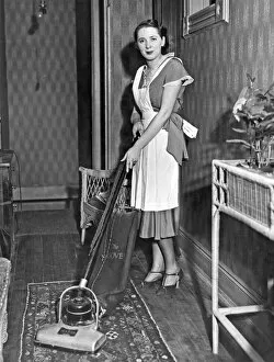 Related Images Collection: A Woman Vacuuming
