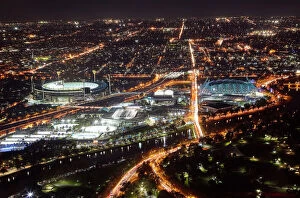 City Street Collection: Aerial view of sports venues in Melbourne illuminated at night