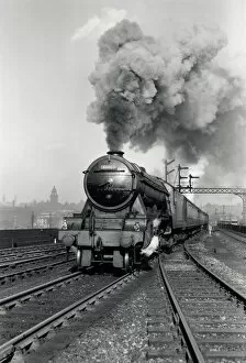The Flying Scotsman Collection: Flying Scotsman A3 Class steam locomotive leaving Leeds station, 1956