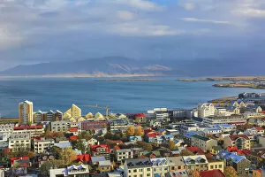Landscape paintings Canvas Print Collection: Aerial view over downtown Reykjavik with ocean and mountain at back, Iceland