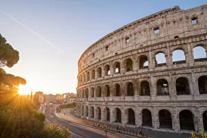 Street art Photo Mug Collection: High angle view over the Colosseum at sunrise. Rome, Lazio, Italy