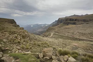 Related Images Poster Print Collection: Landscape shot of 4x4 vehicles driving Sani Pass on the border of KwaZulu-Natal