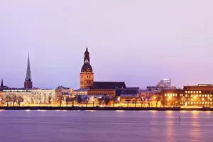 Posters Photo Mug Collection: Old Riga skyline at dusk and Daugava river. Riga, Latvia