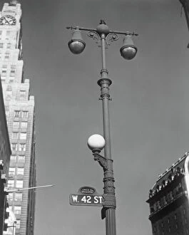 George White Collection: USA, New York, New York City, lamp post on West 42nd Street, low angle view