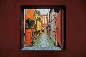 Towers and city walls Metal Print Collection: View to the canal through square window, Bologna, Emilia-Romagna, Italy