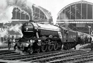 The Flying Scotsman Framed Print Collection: The Flying Scotsman pulls out of Londons Kings Cross station to make the last