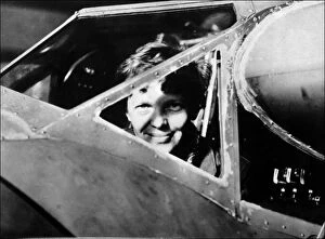Amelia Earhart (1897-1939) Collection: Amelia Earhart looking through the cockpit window