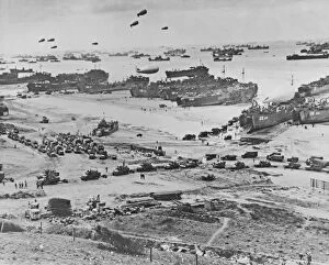 Landings Collection: Bird s-eye view of landing craft, barrage balloons, and allied troops landing in Normandy