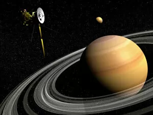 Universe Collection: Cassini spacecraft orbiting Saturn and and its moon Titan