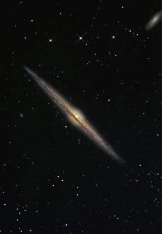 Spiral Galaxy Collection: NGC 4565 is an edge-on barred spiral galaxy in the constellation Coma Berenices