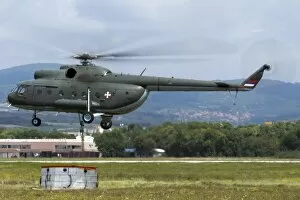 Serbia Cushion Collection: Serbian Air Force Mi-8 helicopter with bambi bucket