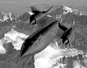 John Speed Photographic Print Collection: A SR-71B Blackbird flying across the Sierra Nevada Mountains