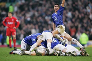 Liverpool Collection: The Everton team pile on Lee Carsley after his goal