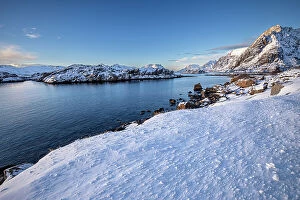 North Island Jigsaw Puzzle Collection: Snow over shore and mountains in winter, Henningvaer, Lofoten Islands, Norway. March, 2023