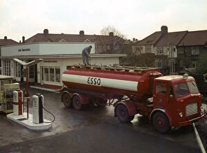 Forecourt Collection: Ilford Esso petrol station with Leyland tanker making delivery 1964. Creator: Unknown