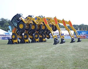 Related Images Premium Framed Print Collection: Stunt JCB diggers perfoming formation dance routine at New Forest show 2006