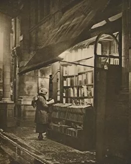 Browsing Collection: Wet Winter Evening and a Book Lover in Bloomsbury, c1935. Creator: Fincham