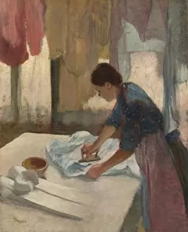 Impressionist paintings Pillow Collection: Woman Ironing, begun c. 1876, completed c. 1887. Creator: Edgar Degas