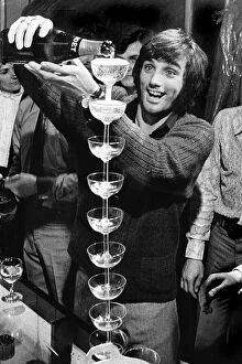 George Best Pillow Collection: George Best pouring champagne
