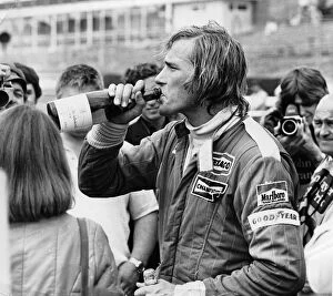 1970s Collection: James Hunt swigging champagne