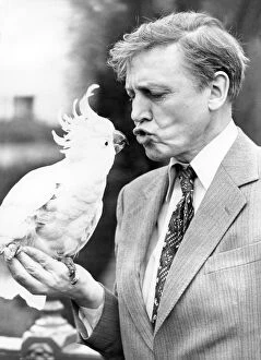 B And W Collection: Sir David Attenborough with a cockatoo