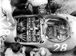 France Photo Mug Collection: 1956 French Grand Prix: Mechanics look at the straight 8 Bugatti 251 engine in Trintignants