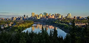Typically Canadian Collection: Skyline Of Downtown Edmonton Reflected In The North Saskatchewan River Under A Blue Sky; Edmonton
