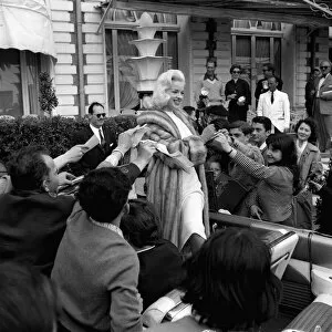 Photographer Collection: Actress Diana Dors surrounded by autograph hunters at Cannes Film Festival