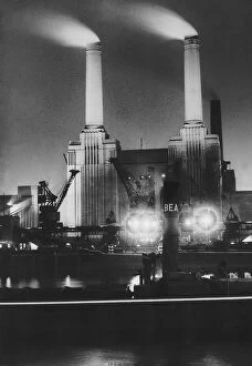 Battersea Cushion Collection: Battersea Power Station at night July 1950, Coal ships unload at Battersea Power Station