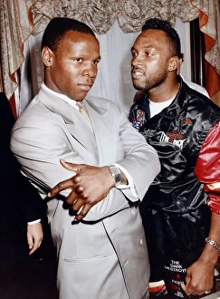 Afro Caribbean Collection: Boxers Chris Eubank (right) and Nigel Benn at the Cafe Royal in Piccadilly Circus ahead