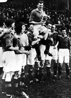 Celebrating Collection: George Young Glasgow Rangers Captain is held aloft by team mates after winning the 1953