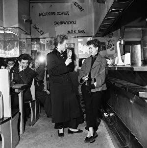 Inner Boroughs Collection: Girls meet up with friends at a coffee bar in Londons West End