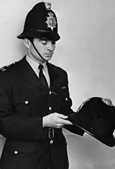 Emergency Services Jigsaw Puzzle Collection: PC John Soanes wearing the new helmets which have been issued to officers in Essex