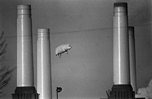 Pink Floyd Collection: Pink Floyd Inflatable Flying Pig at Battersea Power Station in London during filming of