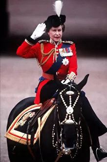 Queen Elizabeth II Pillow Collection: The Queen Trooping The Colour takes salute at Palace gates. June 1984