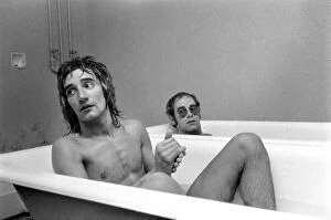 Trains Photo Mug Collection: Singers Elton John and Rod Stewart having bath at Watford football ground