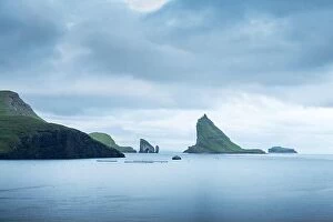 Aerial Views Collection: Dramatic view on Drangarnir and Tindholmur sea stacks in Atlantic ocean, Faroe Islands