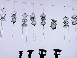 Genre Collection: 'Environmental choreography'. Fishing nets hung on a wire