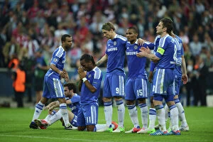 Chelsea Pillow Collection: Didier Drogba in Prayer during Chelsea's UEFA Champions League Final Showdown with FC Bayern